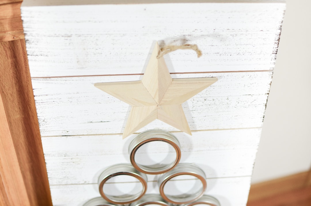 DIY Mason Jar Lid Christmas Tree that is simple to create and a beautiful piece of farmhouse style Christmas decor. Rustic Christmas crafts and home decor.