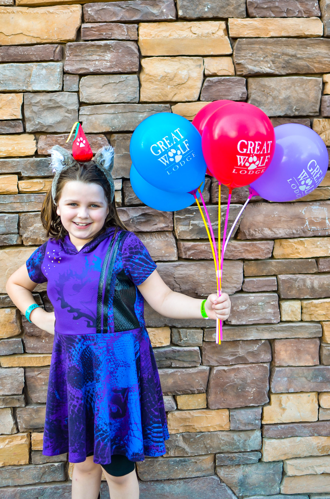 Great Wolf Lodge balloons held by birthday girl